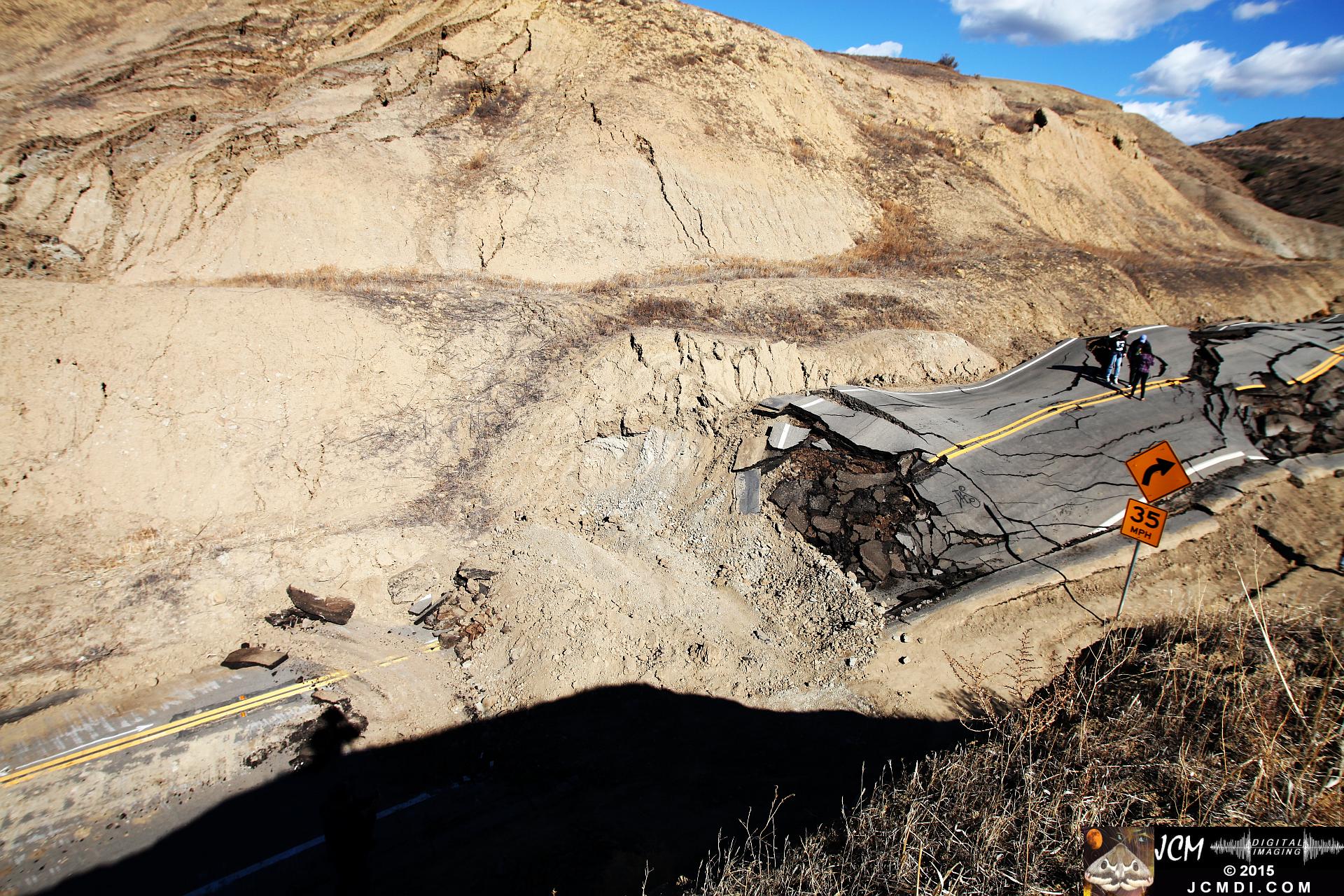 Landslide, buckled pavement, and terrain at Vasquez Canyon Road in Santa Clarita, CA filmed 11-25-2015